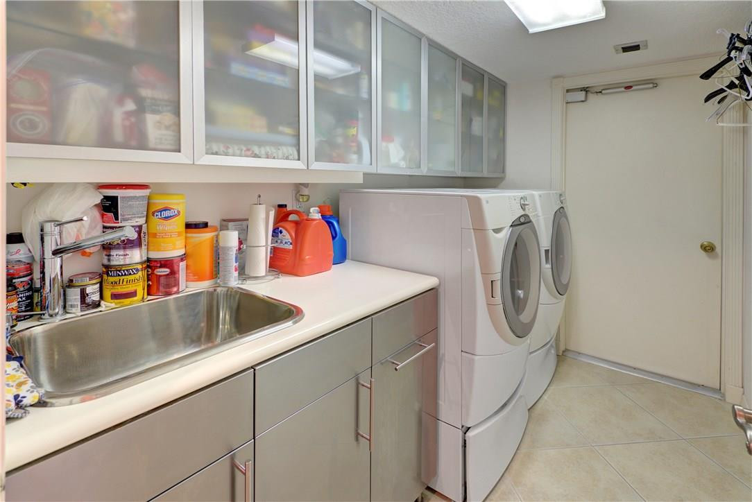 21308 Placida Terrace Boca Raton, FL 33433 - Photo 29 of 33 laundry room, cabinet space to spare!