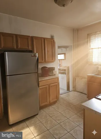 a kitchen with stainless steel appliances a stove microwave and cabinets