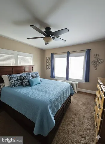 a bedroom with bed and window