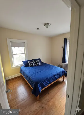 a bedroom with bed and window