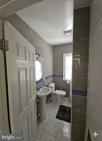 a bathroom with a shower and a sink