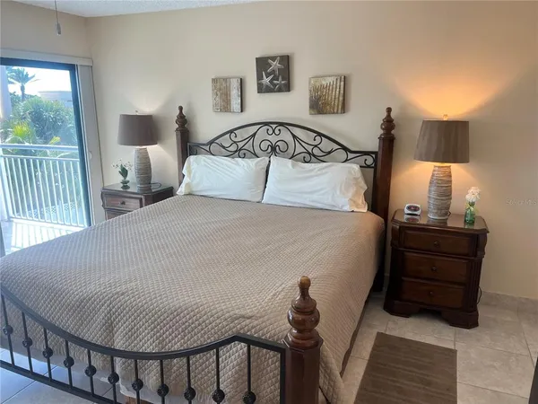 a view of room with mirror and furniture