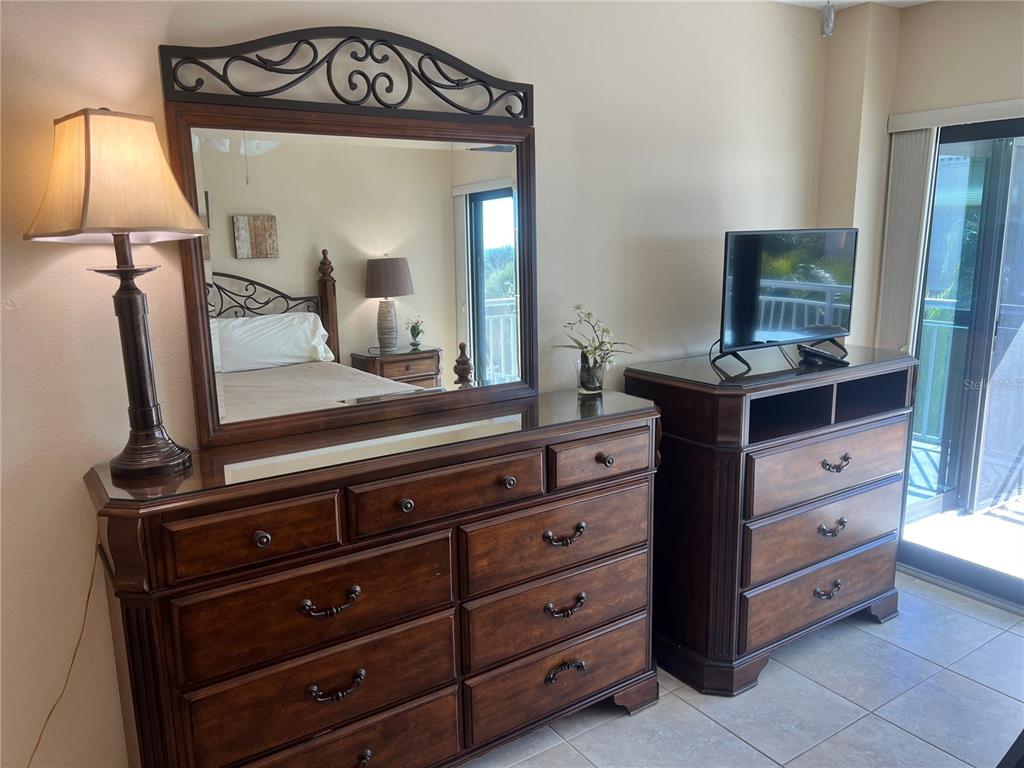 1001 Point Of Rocks Road, Unit 310 Sarasota, FL 34242 - Photo 13 of 35 a view of room with mirror and furniture