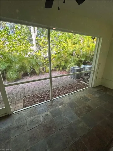 a view of a room with a large window