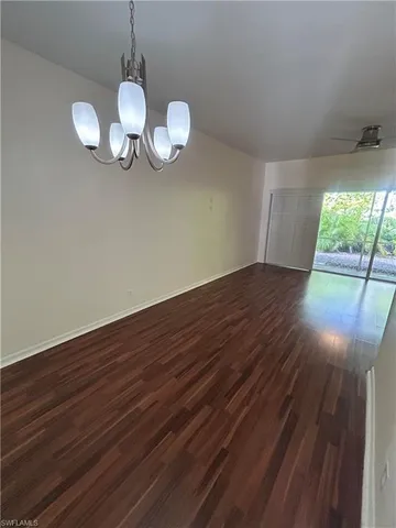 a view of room with wooden floor