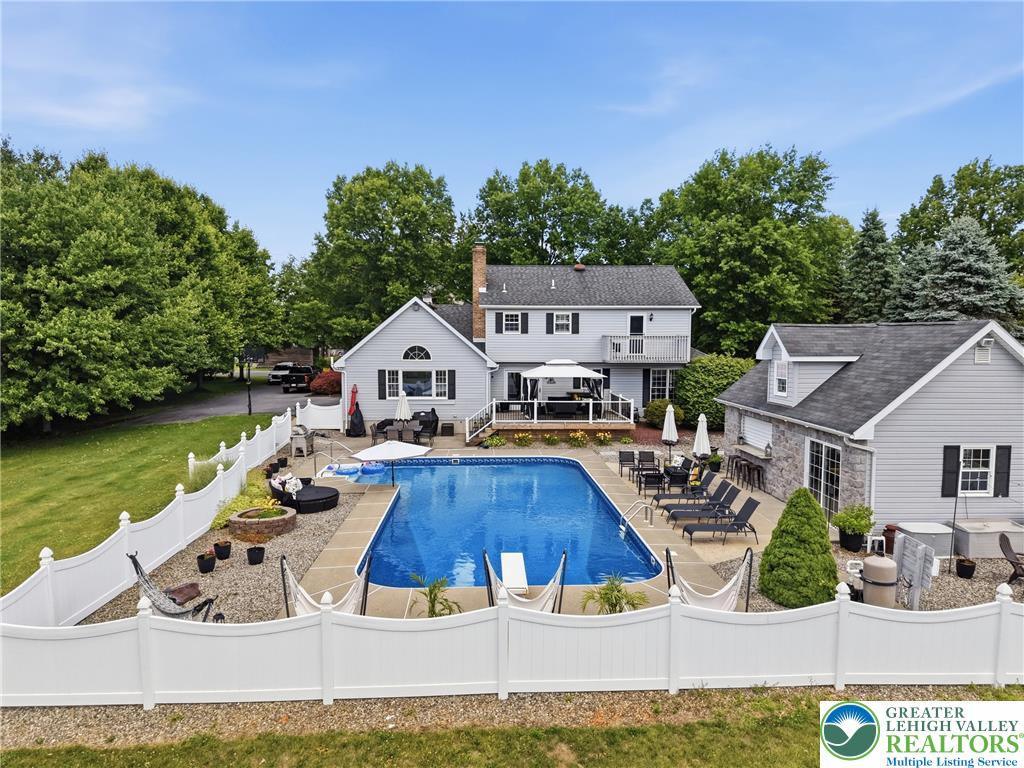 890 Lahr Road Nazareth, PA 18064 - Photo 2 of 71 An inviting backyard oasis offers a sparkling in-ground pool and ample space for outdoor entertaining.