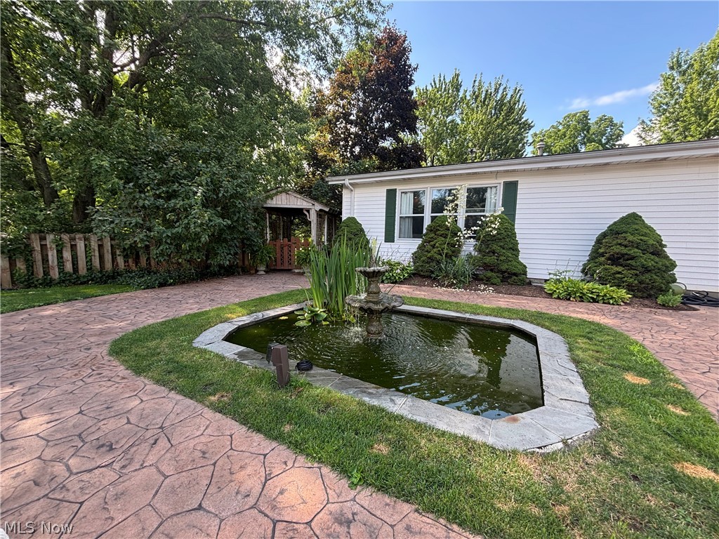 385 Cochran Road Aurora, OH 44202 - Photo 32 of 35 Pond and stamped patio area.