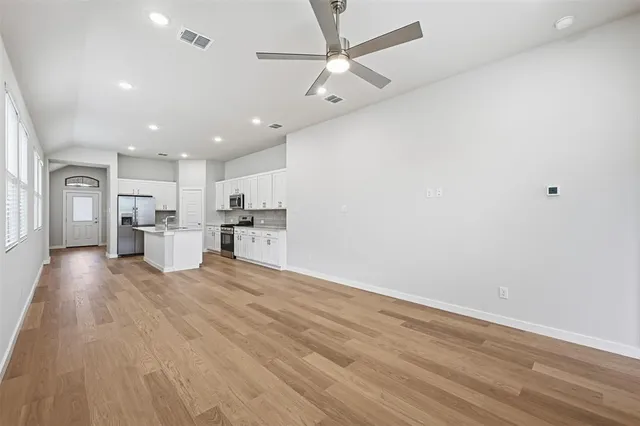 a view of kitchen with wooden floor and window