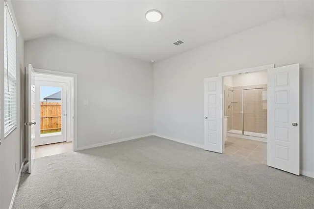 an empty room with a bathroom