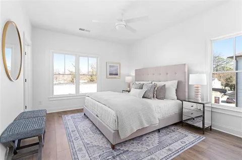 a bedroom with a large bed and a window