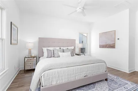 a bedroom with a bed and a night stand