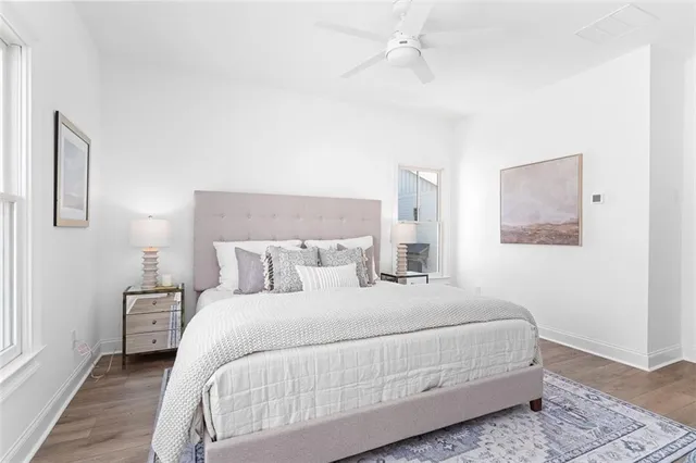 a bedroom with a bed and a night stand