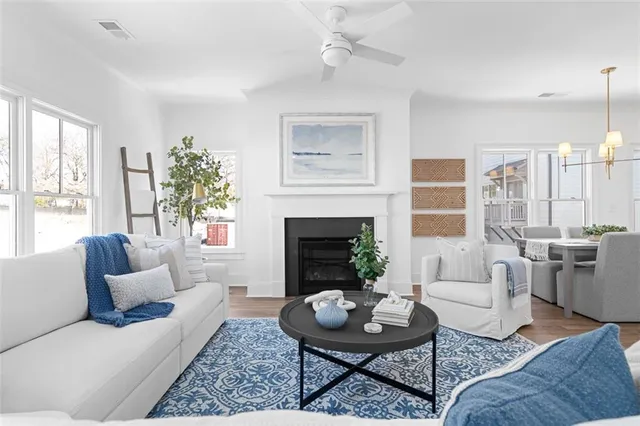 a living room with furniture and a fireplace