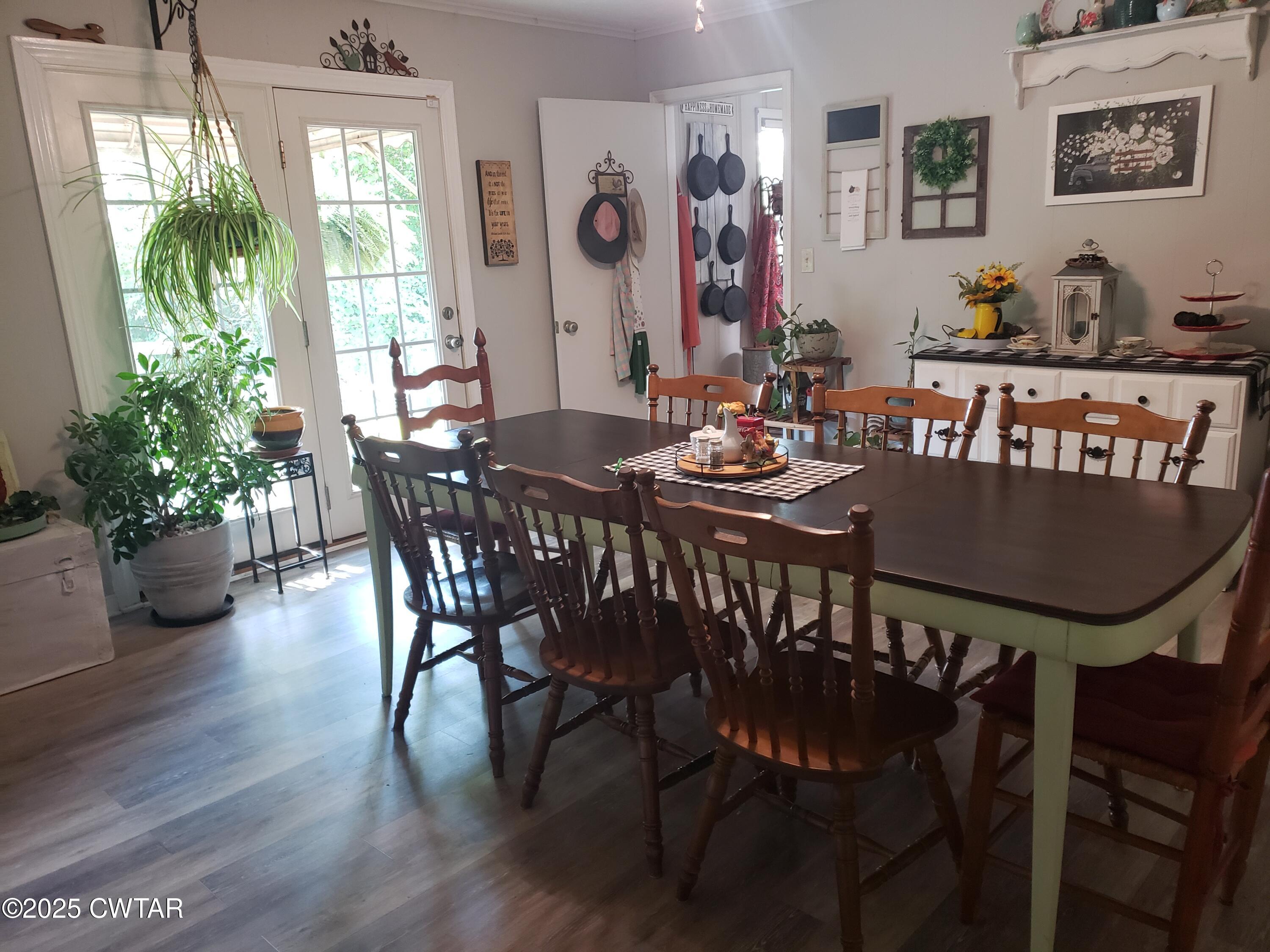99 Montclair Drive Jackson, TN 38301 - Photo 3 of 19 a view of a dining room with furniture window and wooden floor