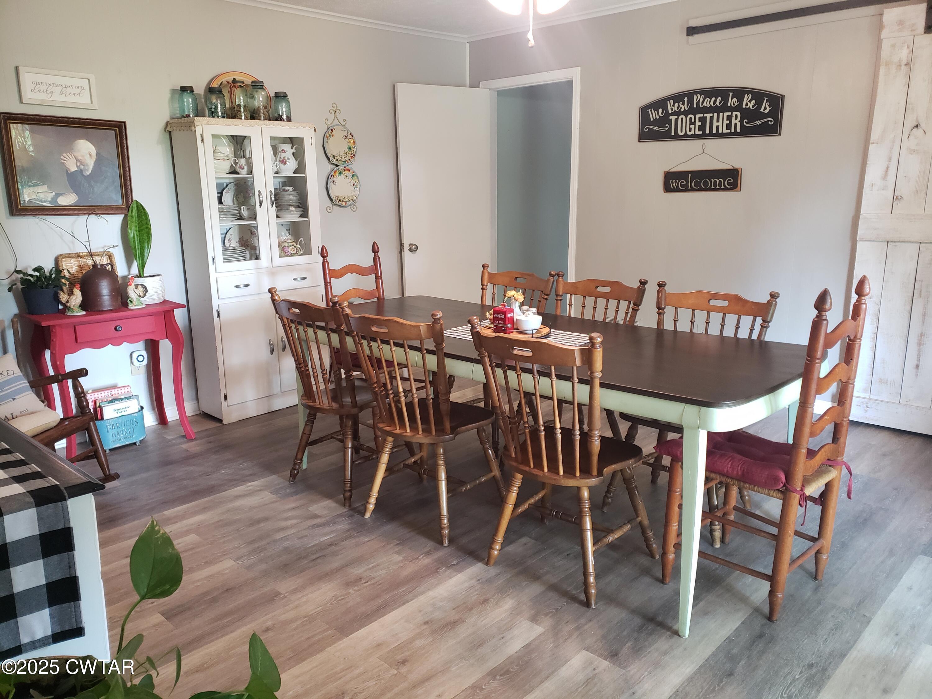 99 Montclair Drive Jackson, TN 38301 - Photo 4 of 19 a view of a dining room with furniture and wooden floor