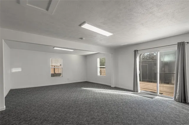 a bathroom with a granite countertop sink a mirror and a