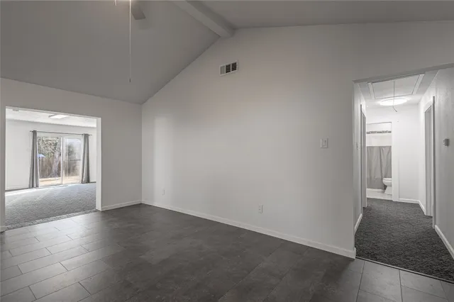a kitchen with refrigerator and cabinets