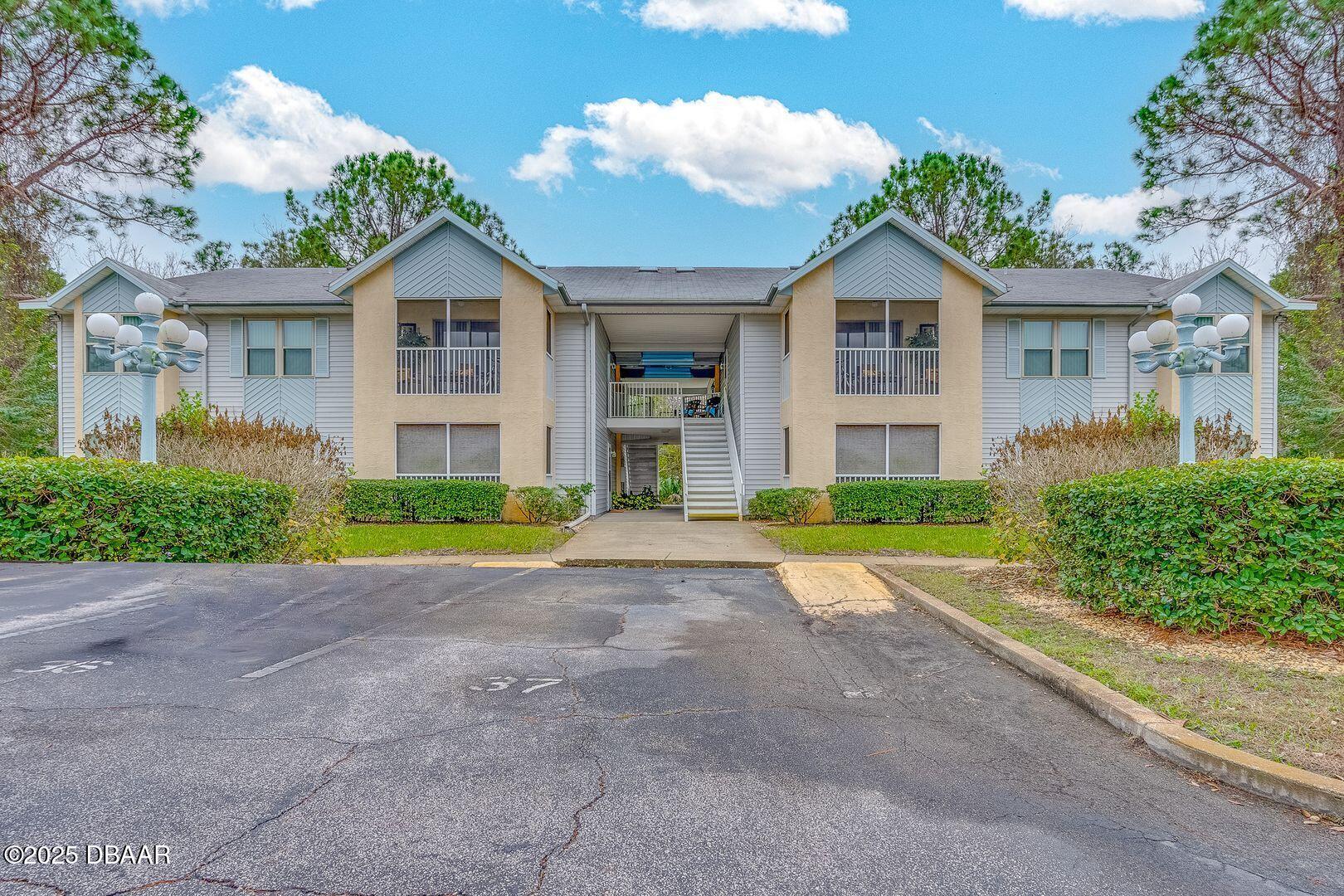 a view of front a house with a yard