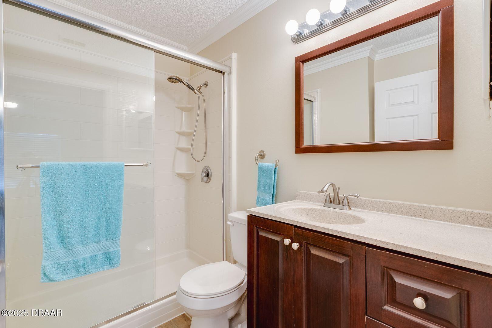 101 Bent Tree Drive, Unit 33 Daytona Beach, FL 32114 - Photo 10 of 27 a bathroom with a sink a toilet and shower