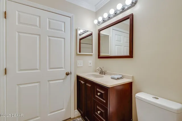 a bathroom with a sink double vanity granite tub shower and a mirror