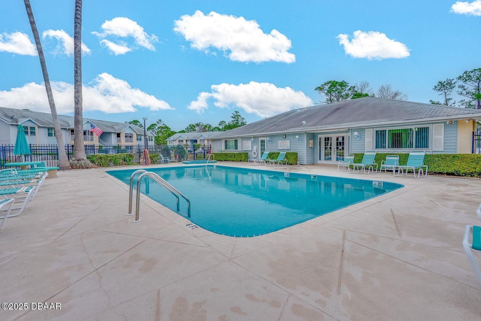 101 Bent Tree Drive, Unit 33 Daytona Beach, FL 32114 - Photo 18 of 27 a view of a house with a swimming pool
