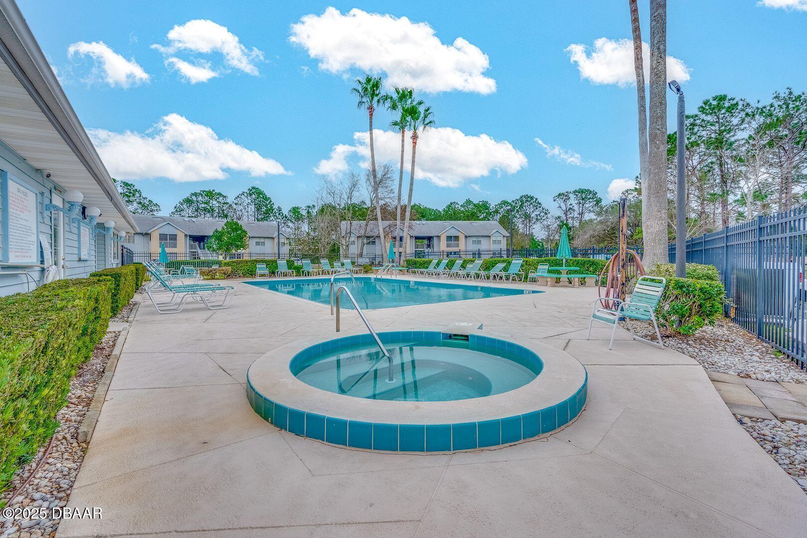 101 Bent Tree Drive, Unit 33 Daytona Beach, FL 32114 - Photo 19 of 27 a view of a swimming pool with a fountain