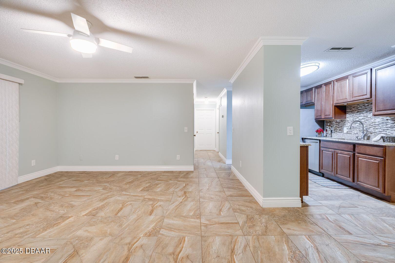 101 Bent Tree Drive, Unit 33 Daytona Beach, FL 32114 - Photo 27 of 27 a view of a kitchen with a sink and a refrigerator