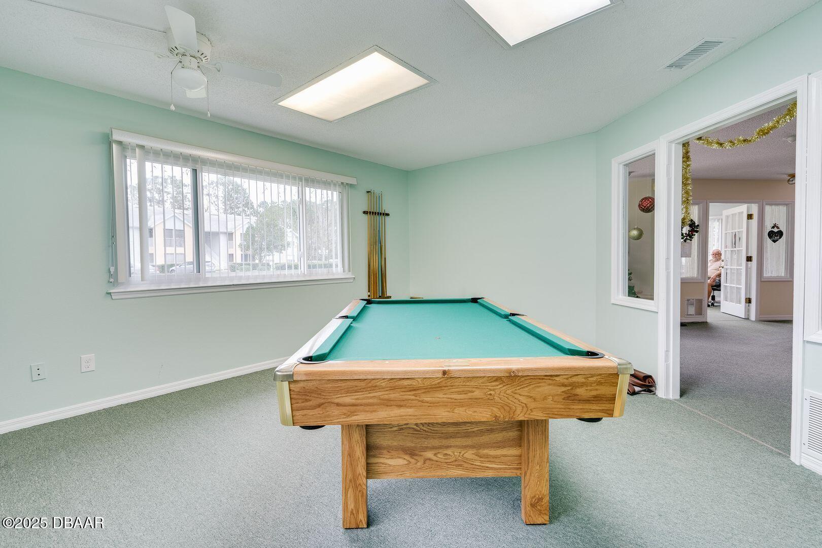 101 Bent Tree Drive, Unit 33 Daytona Beach, FL 32114 - Photo 23 of 27 a room with pool table and windows