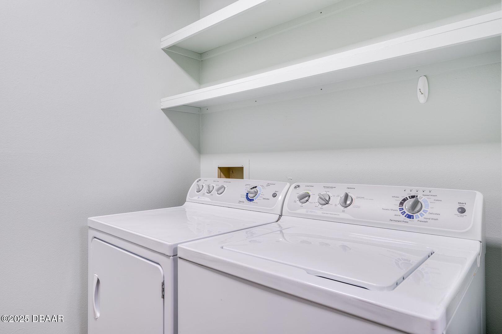 101 Bent Tree Drive, Unit 33 Daytona Beach, FL 32114 - Photo 6 of 27 a utility room with dryer and washer