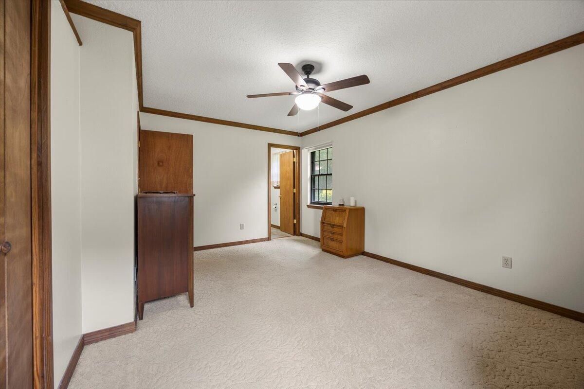 7112 Wells Avenue Navarre, FL 32566 - Photo 28 of 43 a view of an empty room with a ceiling fan