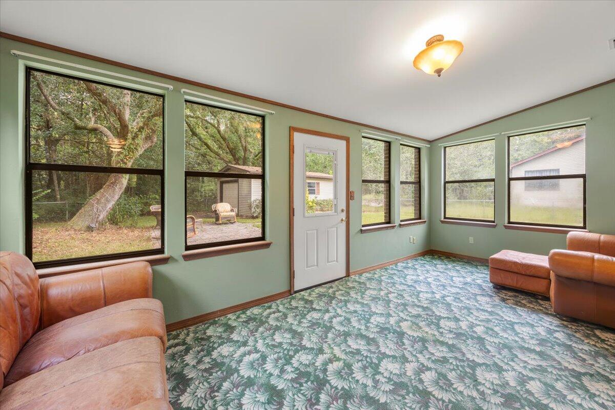 7112 Wells Avenue Navarre, FL 32566 - Photo 34 of 43 a bedroom with furniture and a window