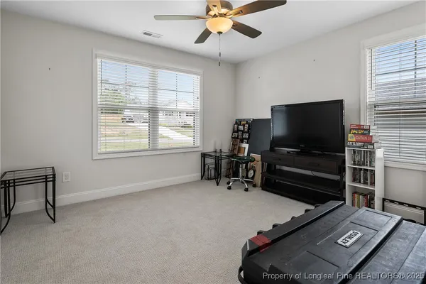 a room with furniture and flat screen tv
