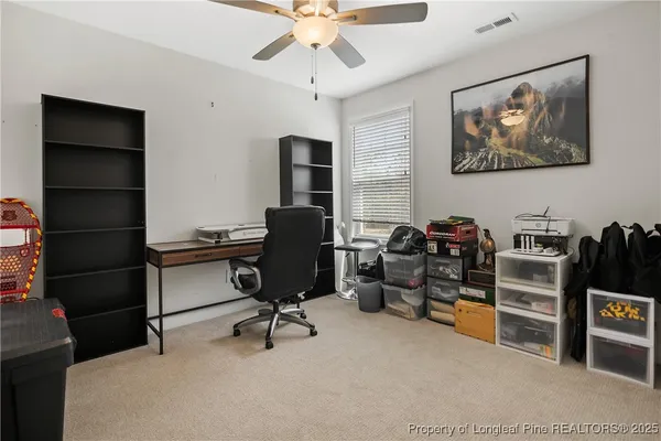 a view of a workspace with furniture