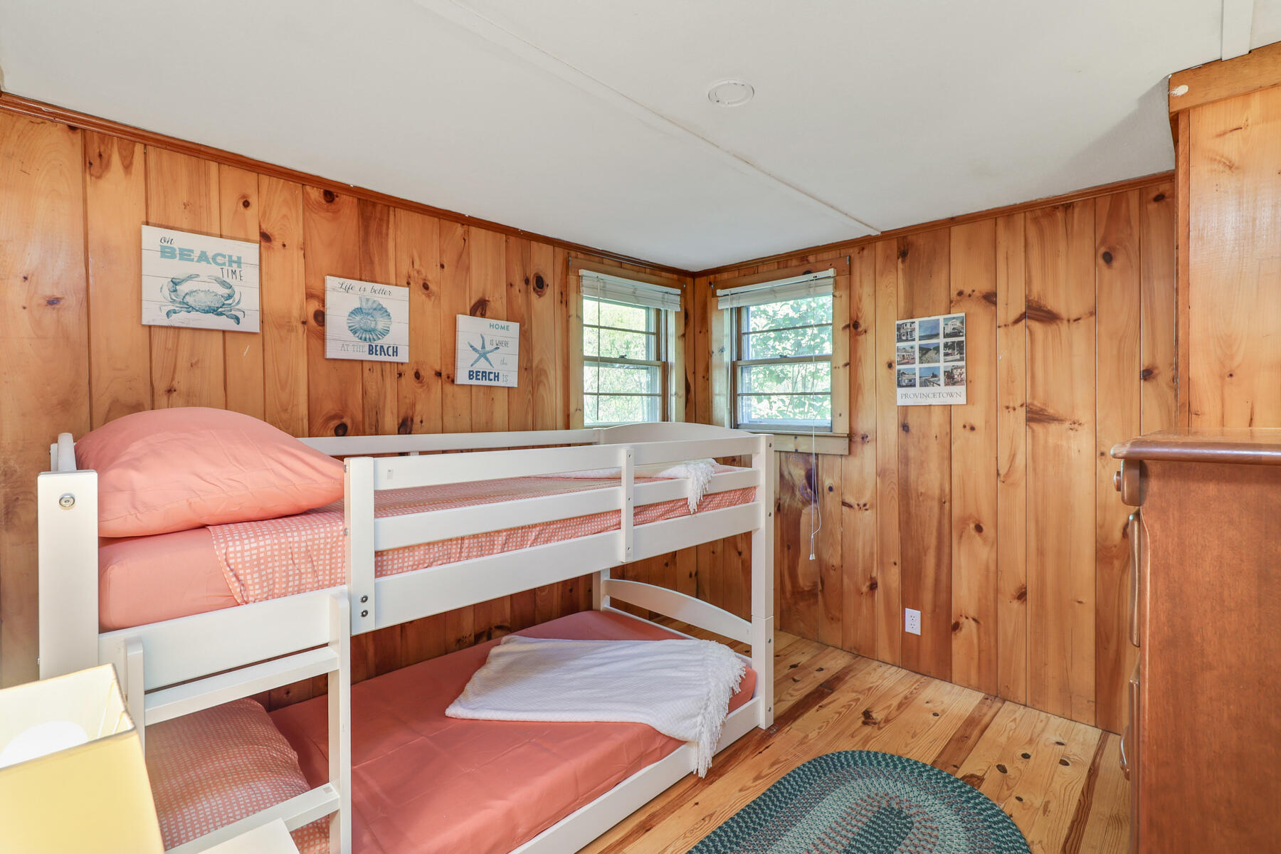 46 King Phillip Road Wellfleet, MA 02667 - Photo 11 of 32 a bedroom with a bed and a dresser