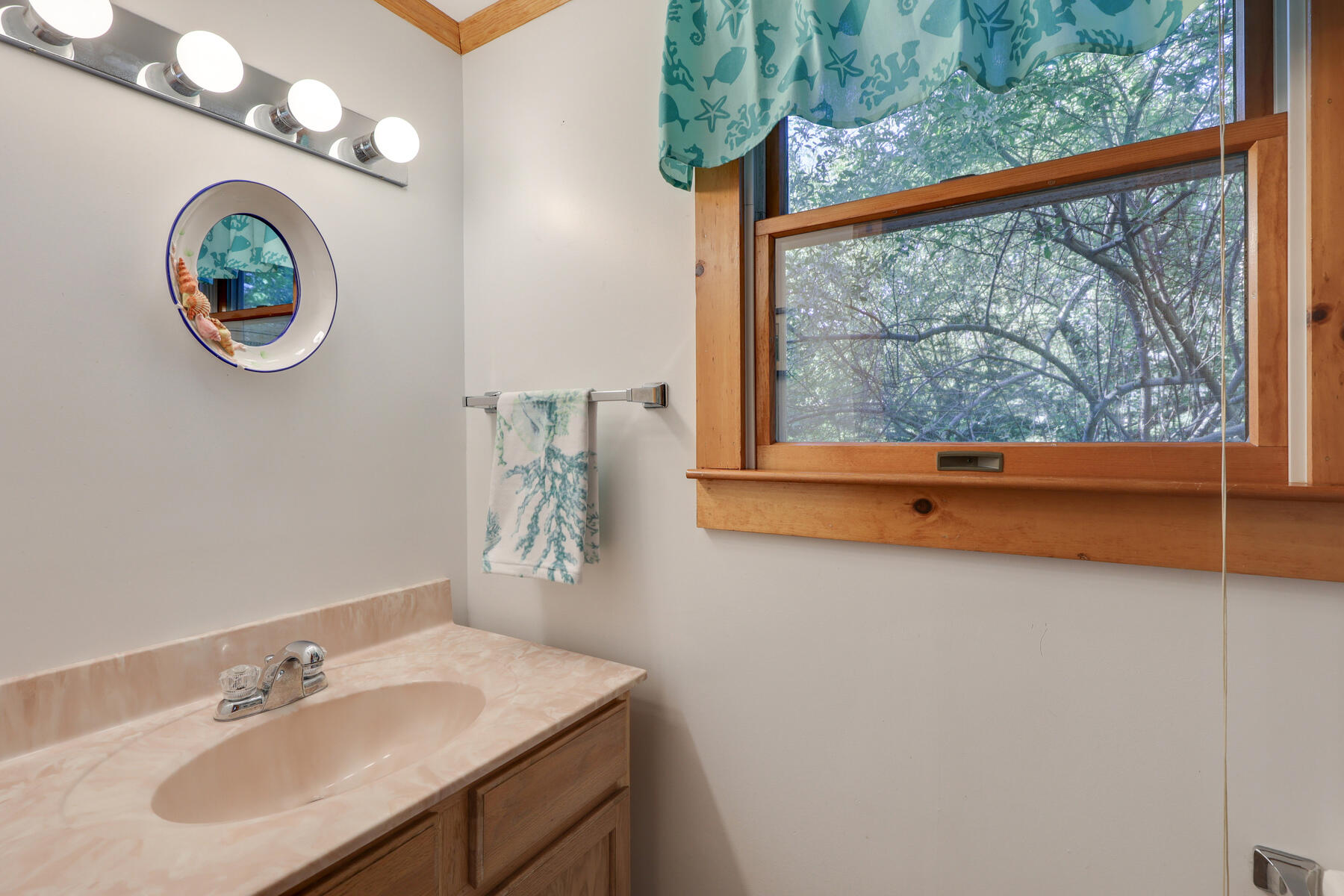 46 King Phillip Road Wellfleet, MA 02667 - Photo 14 of 32 a bathroom with a sink and a mirror