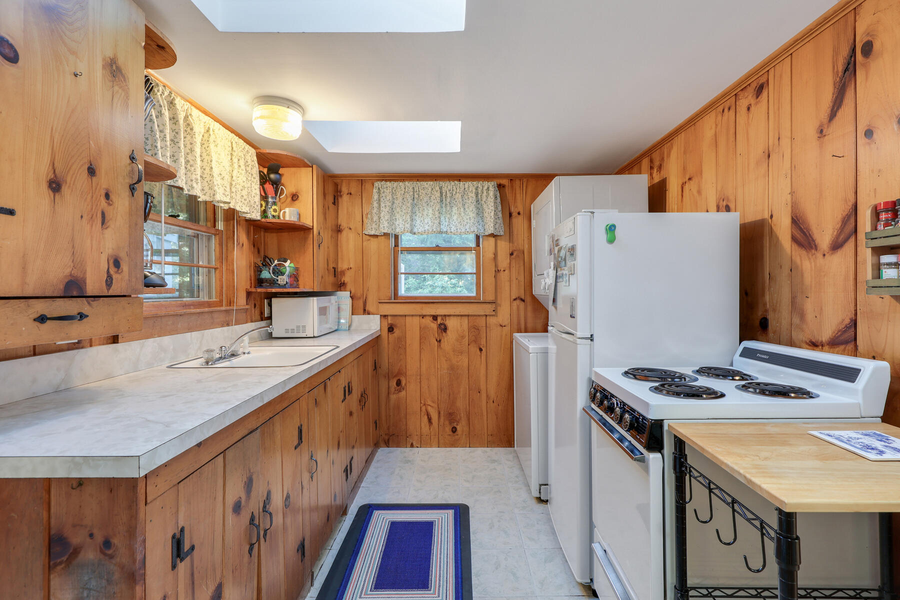 46 King Phillip Road Wellfleet, MA 02667 - Photo 17 of 32 a kitchen with stainless steel appliances granite countertop a refrigerator a stove and a sink
