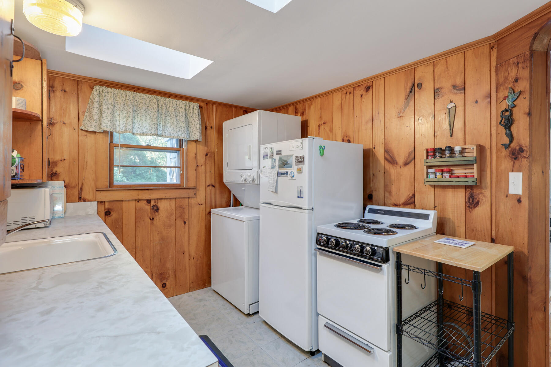 46 King Phillip Road Wellfleet, MA 02667 - Photo 18 of 32 a kitchen with a refrigerator and a stove