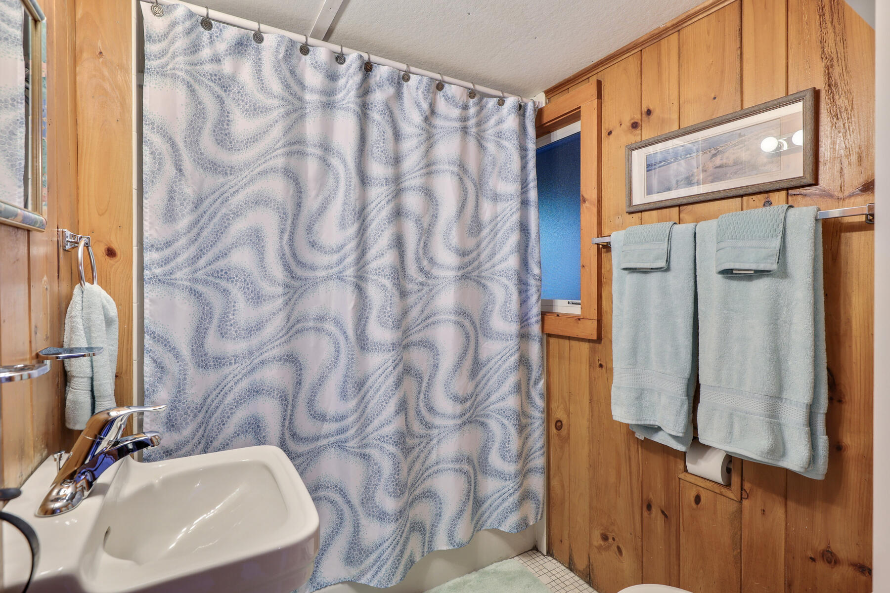 46 King Phillip Road Wellfleet, MA 02667 - Photo 19 of 32 a bathroom with a sink and mirror with toilet