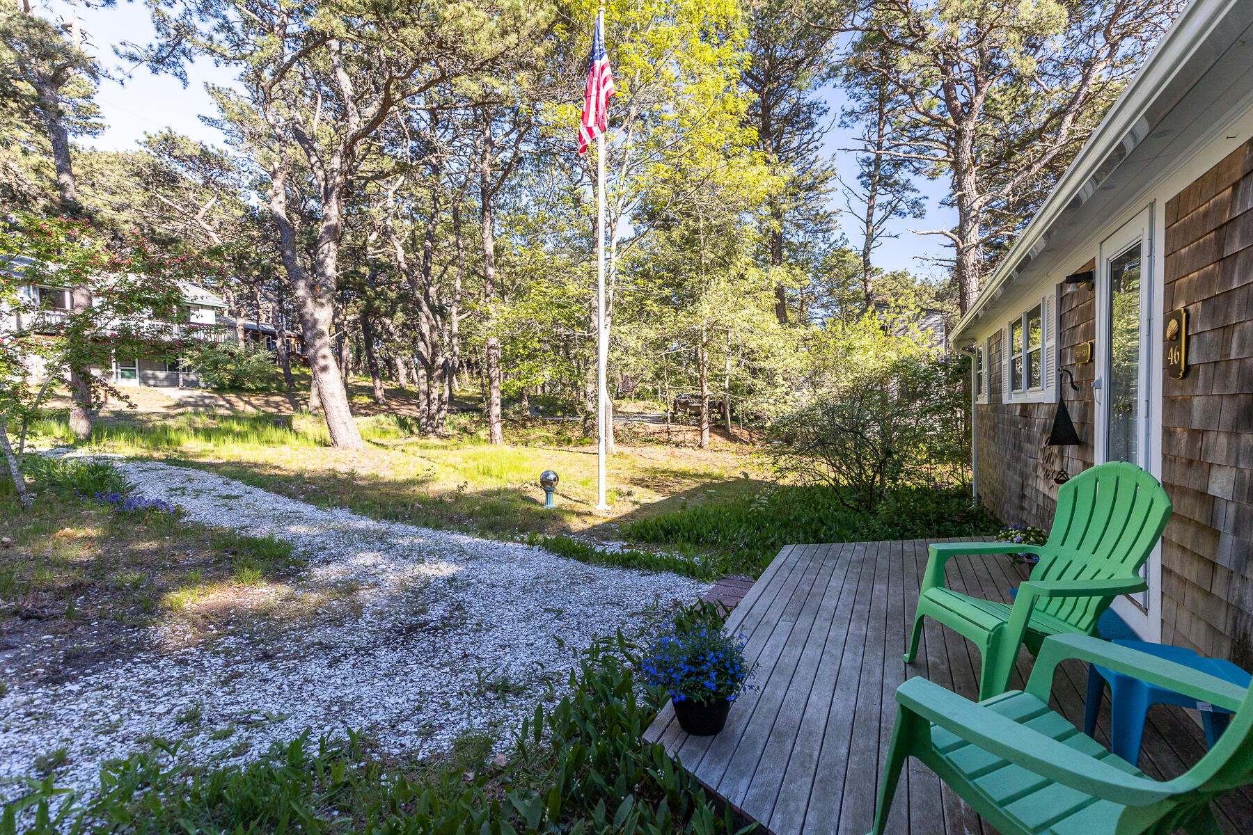 46 King Phillip Road Wellfleet, MA 02667 - Photo 3 of 32 a view of yard with swimming pool and seating