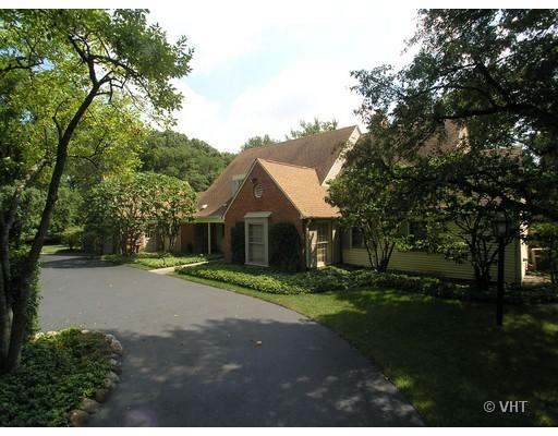 207 Dickens Road Northfield, IL 60093 - Photo 1 of 1 a front view of a house with a garden and tree