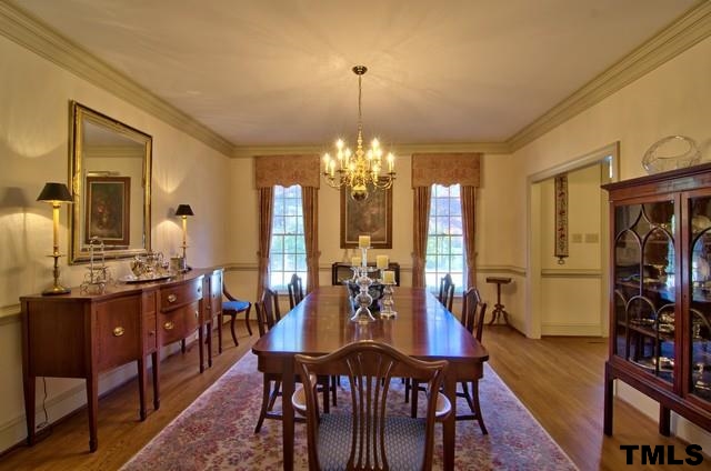 3822 Northampton Road Durham, NC 27707 - Photo 11 of 25 Gorgeous Dining Room is well proportioned for accessory pieces. Beautiful crown mold is representative of custom detail throughout this home.