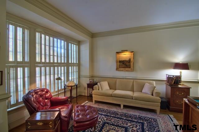 3822 Northampton Road Durham, NC 27707 - Photo 12 of 25 Lovely study is steps from entry hall and connects to the MBR to create suite if desired. Hardwood floors extend from foyer. Charming shutters at the wall of windows can be adjusted for privacy or light.