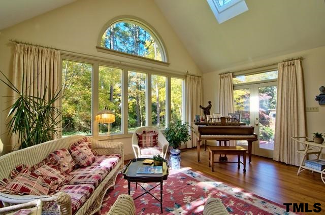3822 Northampton Road Durham, NC 27707 - Photo 6 of 25 Vaulted sunroom ceiling with skylights and large windows to showcase private backyard.
