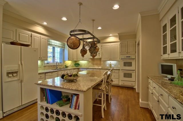 3822 Northampton Road Durham, NC 27707 - Photo 8 of 25 Updated kitchen with attractive granite, wine rack, tile back splash and recipe desk.