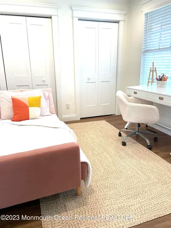 a room with a bed and furniture