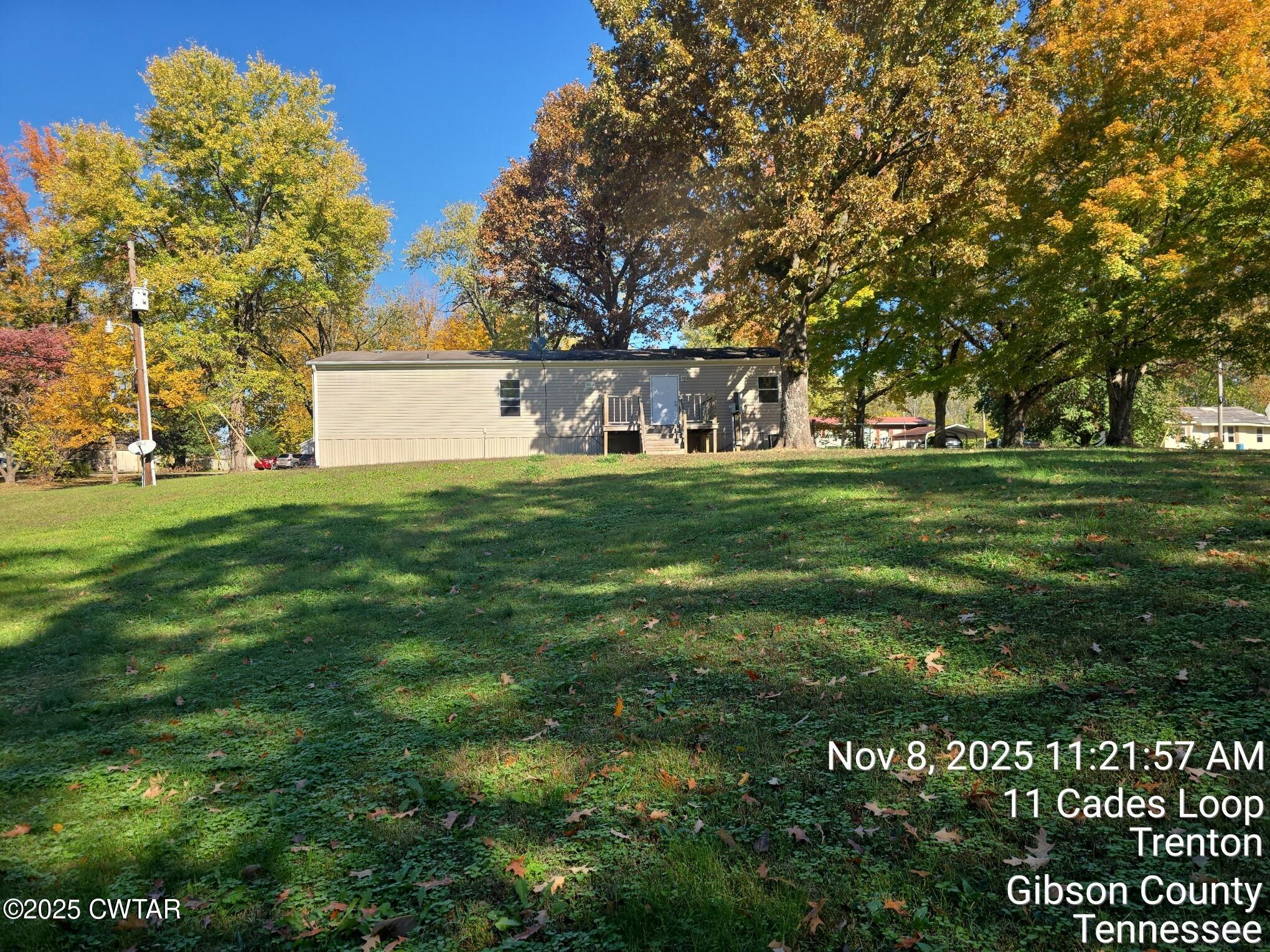 11 Cades Loop Trenton, TN 38382 - Photo 2 of 16 a front view of a house with a yard