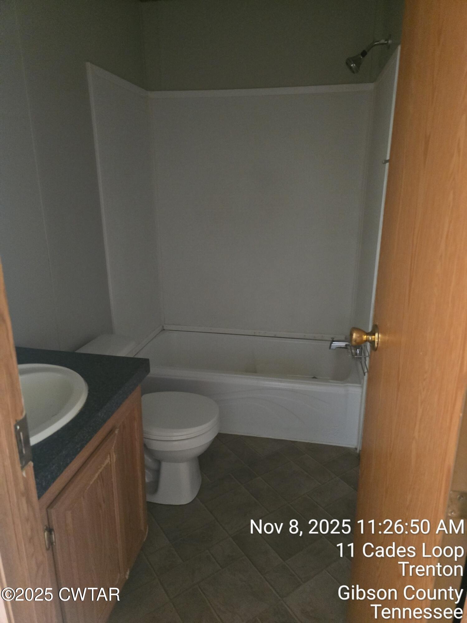 11 Cades Loop Trenton, TN 38382 - Photo 10 of 16 a bathroom with a granite countertop toilet and a sink