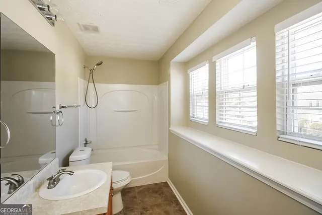 a bathroom with a sink and a bathtub