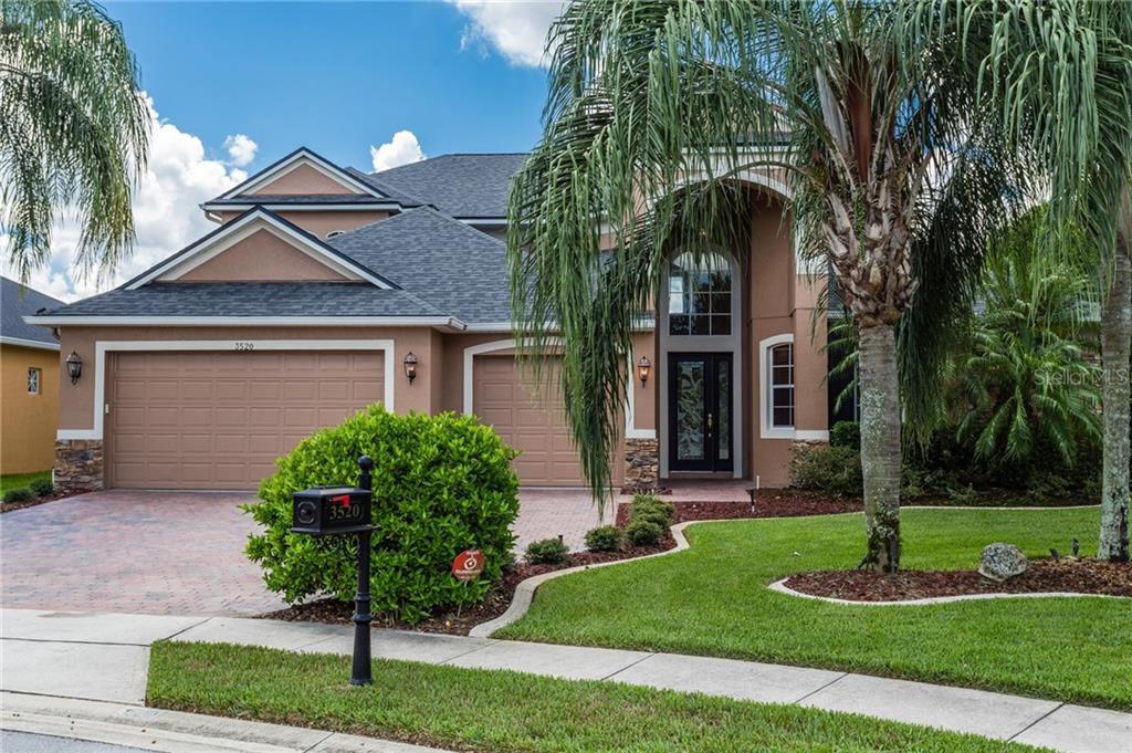3520 Rose Mallow Loop Oviedo, FL 32766 - Photo 1 of 1 a front view of a house with garden