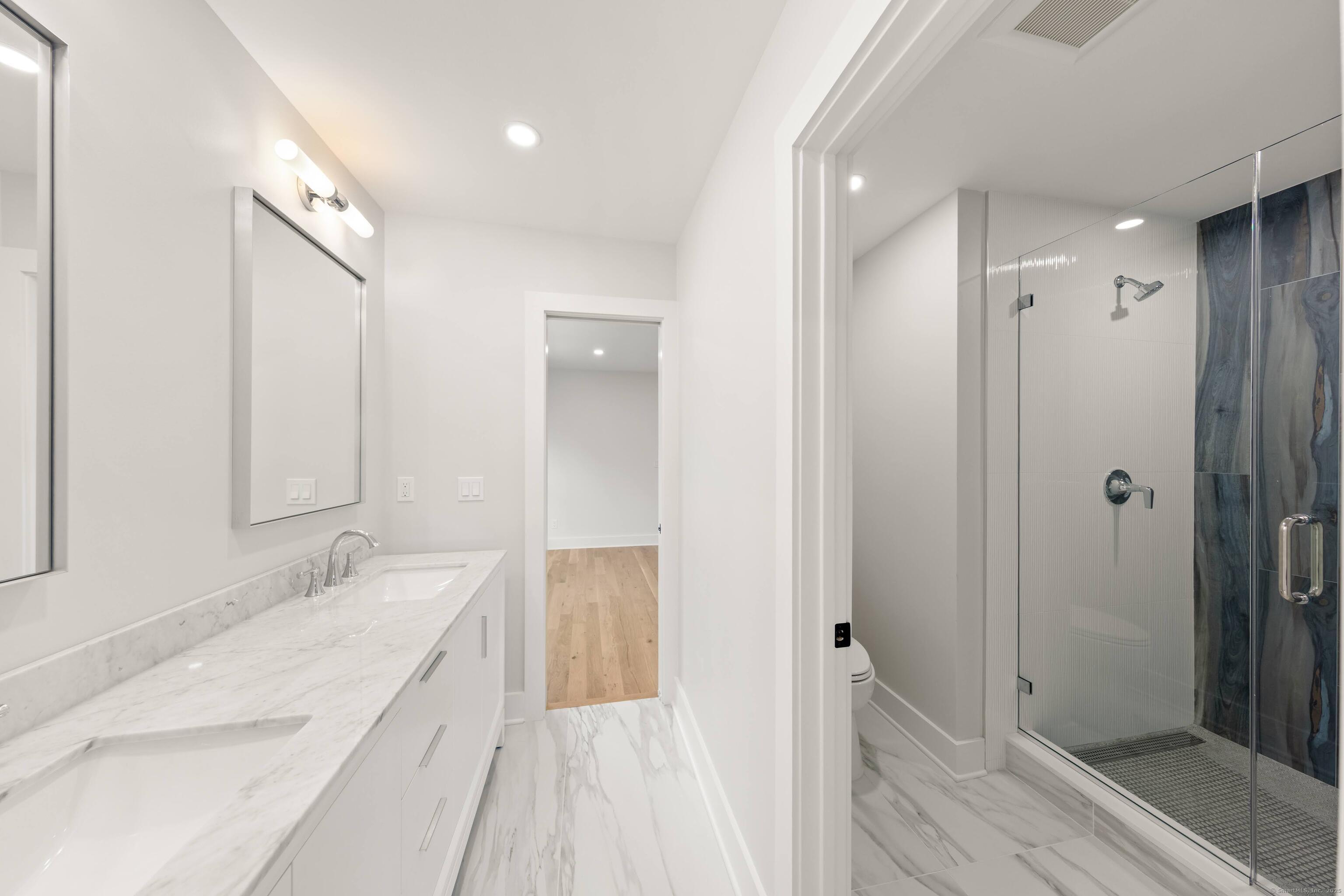 31 Gray Farms Road Stamford, CT 06905 - Photo 29 of 40 a spacious bathroom with a double vanity sink and shower